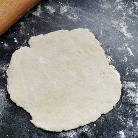 Scone Dough rolled out on a floured work surface 