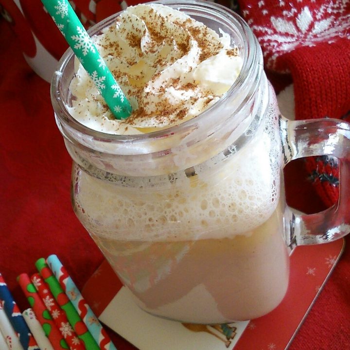 a kilner mug filled with white hot chocolate.