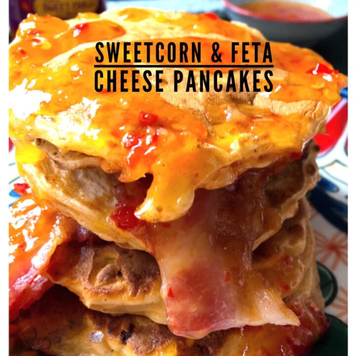a stack of sweetcorn pancakes with bacon and drizzled with sweet chilli sauce