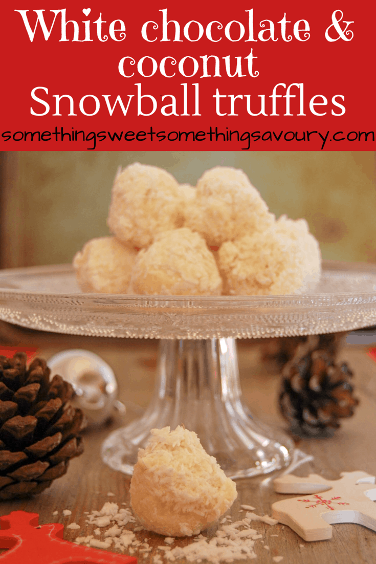 A Pinterest image with the words "white chocolate coconut snowball truffles" and a photo of white chocolate coconut truffles on a vintage glass cake stand. Various Christmas decorations are placed around the plate for a festive look. 