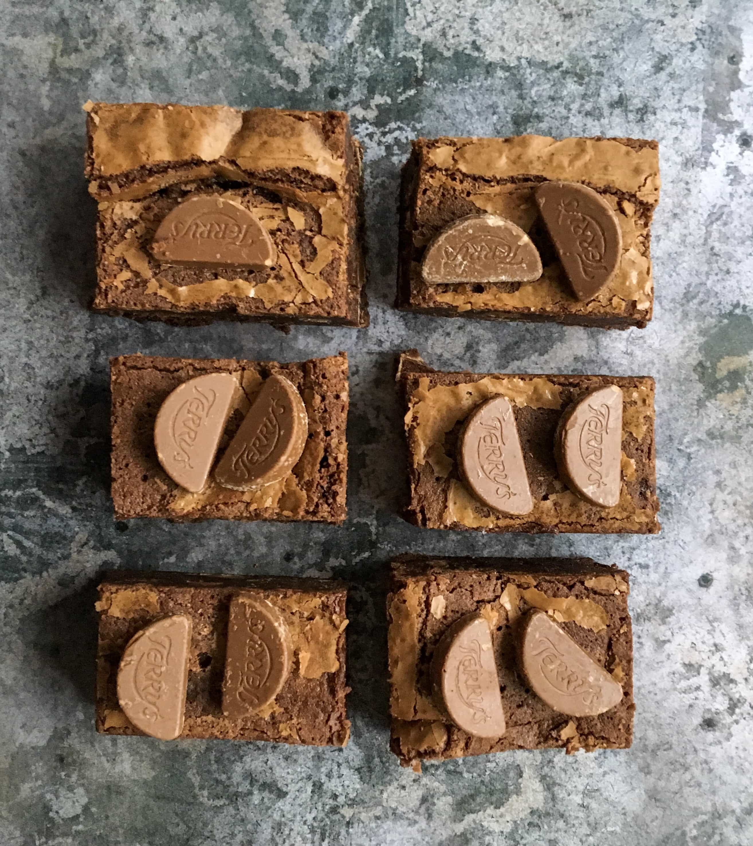 Terry's chocolate orange brownies square on a grey background.