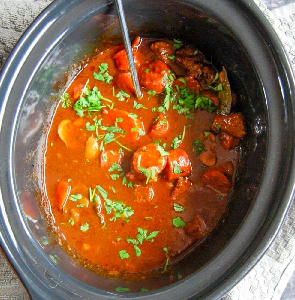 A crockpot with beef and chorizo casserole