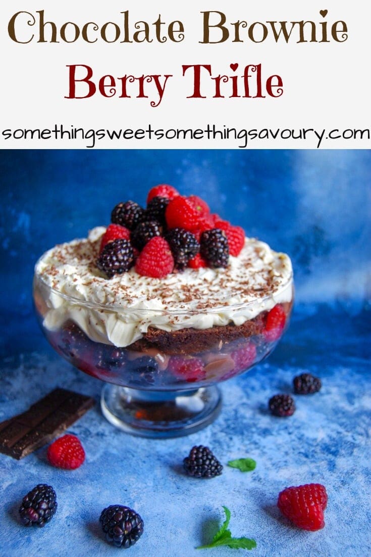 A Pinterest pin with the words "chocolate brownie berry trifle" with a picture of the trifle topped with fresh berries 