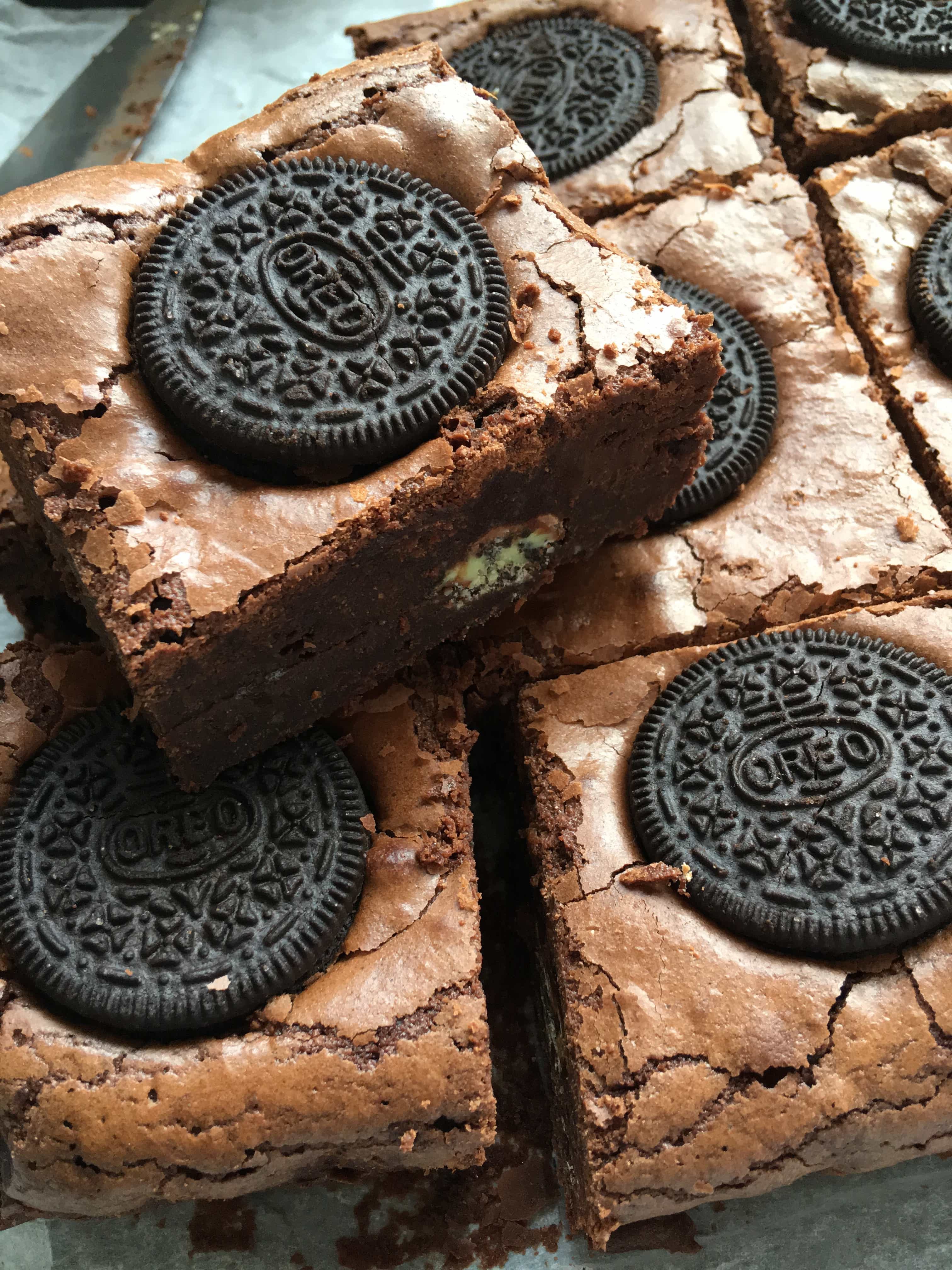 A stack of Mint Oreo Brownies with a mint chocolate oreo filling.