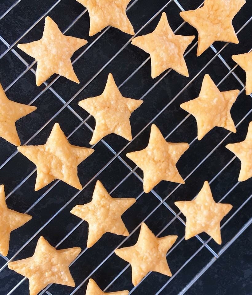 Cheese star biscuits on a sliver wire rack