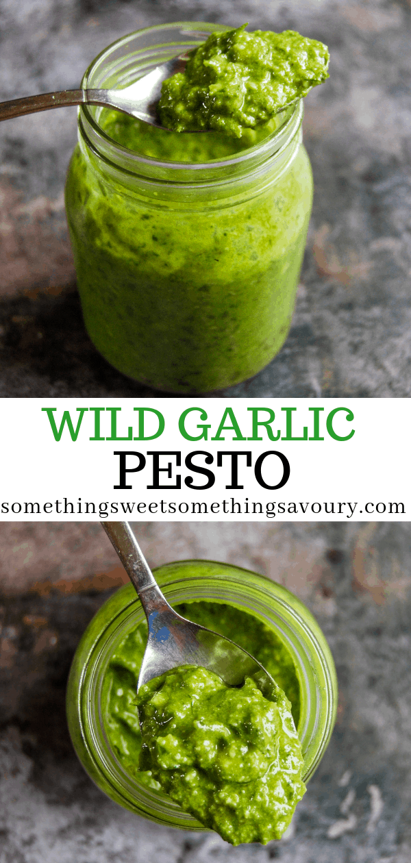 A close up photograph of a jar of wild garlic pesto on a grey background.