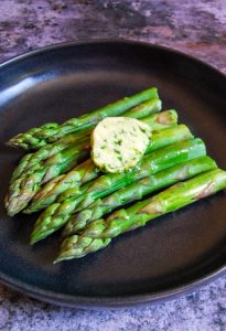 A plate of asparagus spears with Wild Garlic Butter.