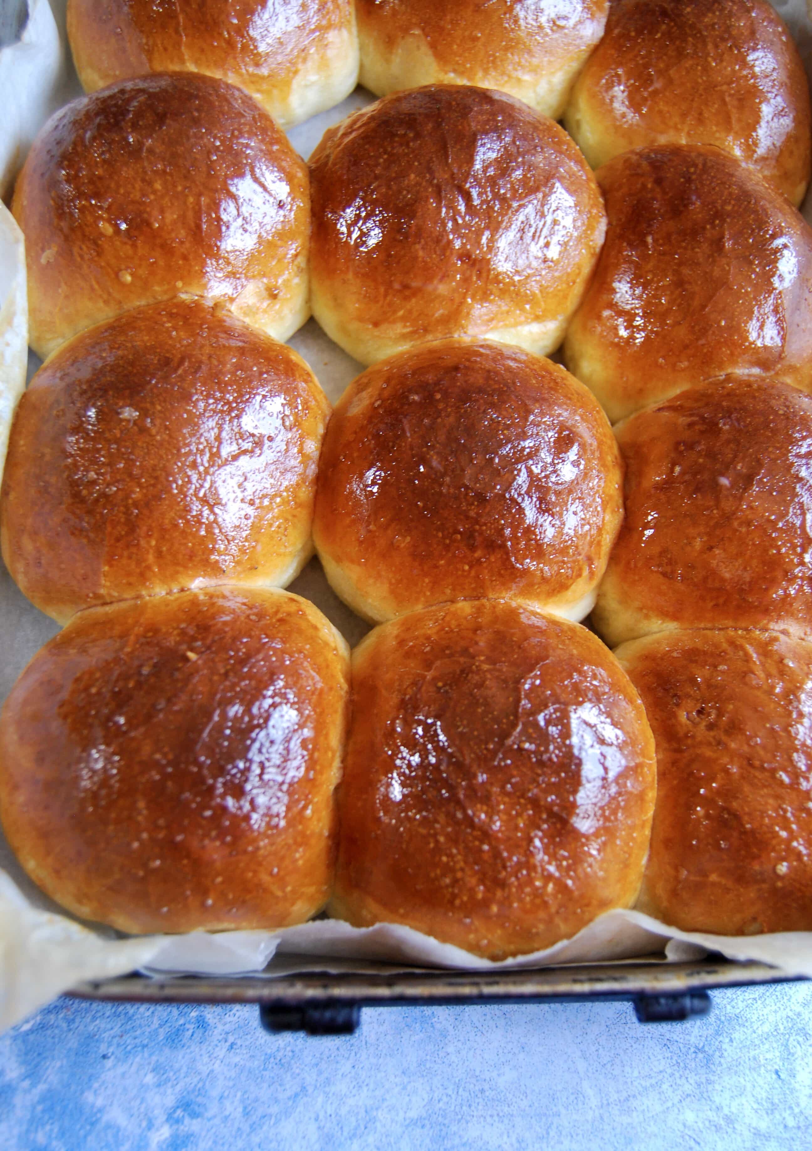 A tray of freshly baked brioche buns.      