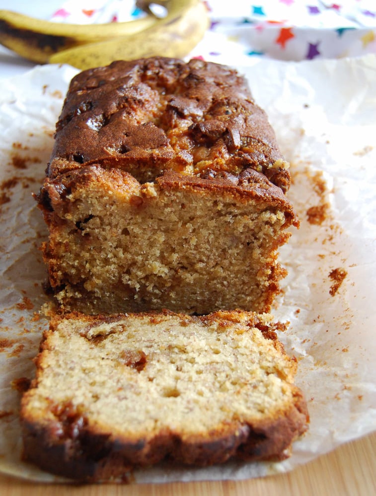 A picture of a banana fudge loaf on a wooden board.