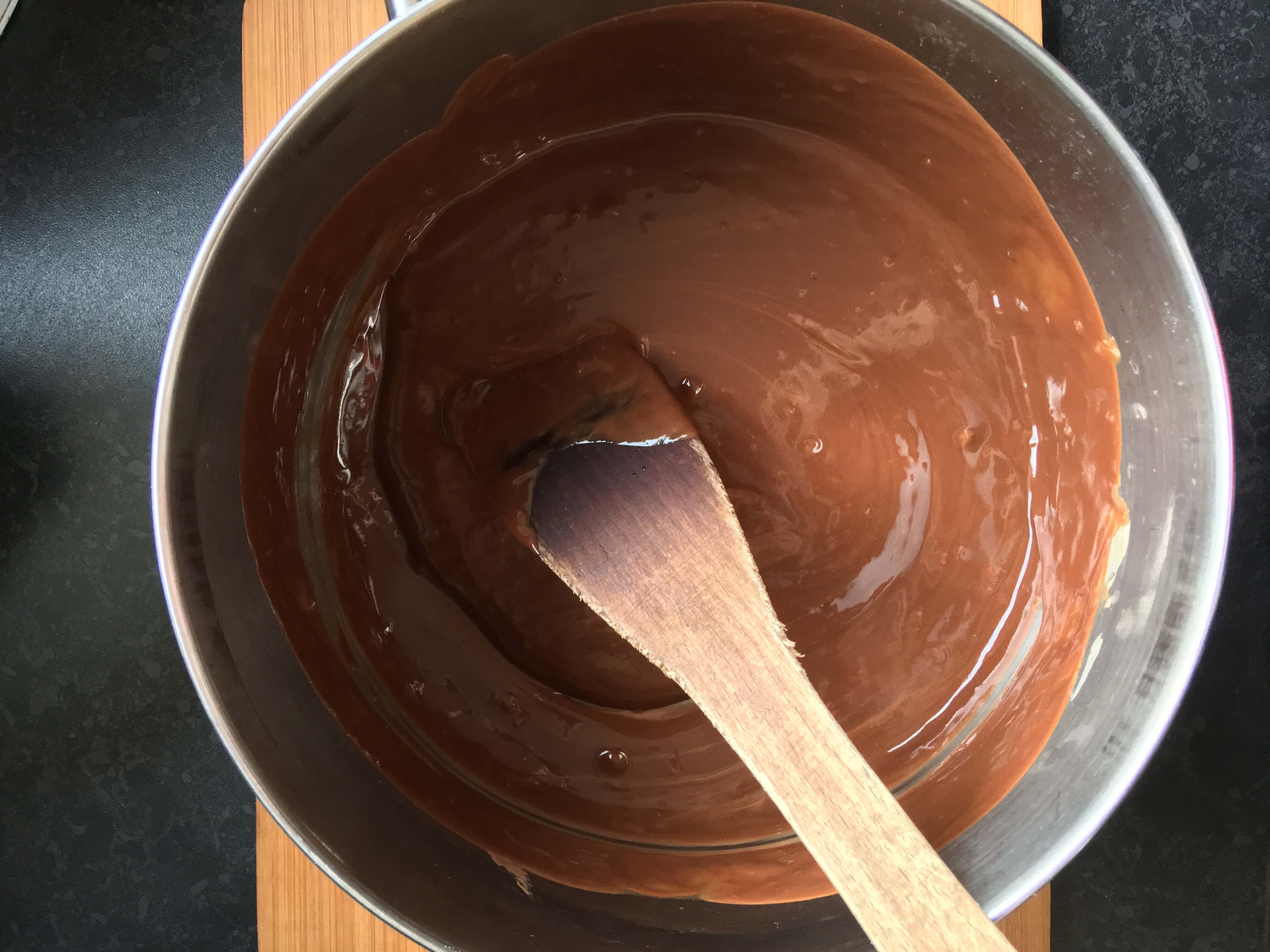 A photo of a pan of melted chocolate, butter and golden syrup 