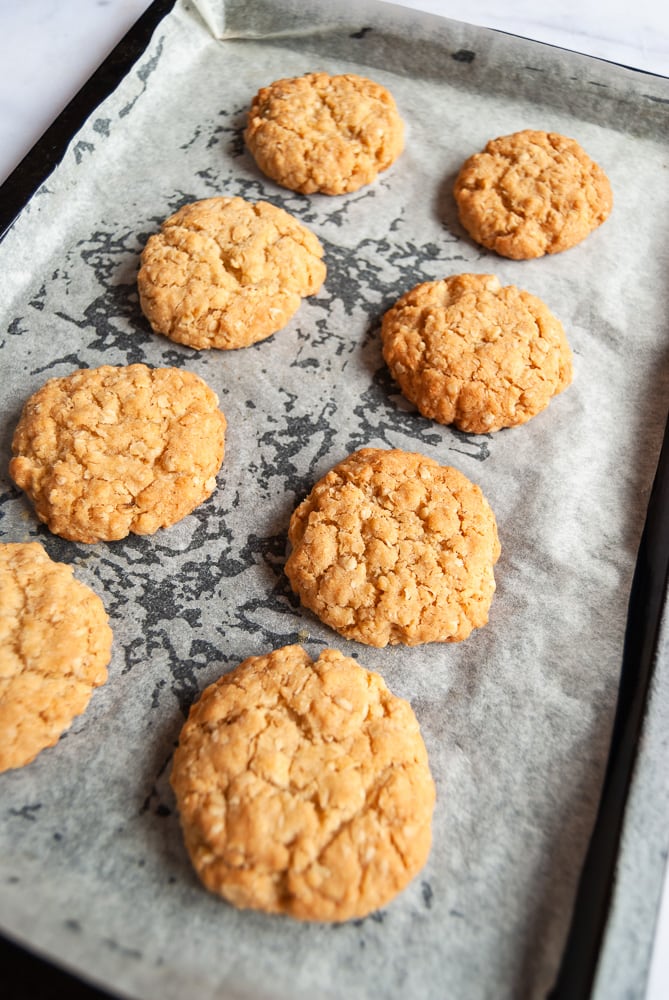 a tray of freshly baked oat cookies.