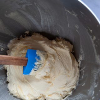 a bowl of creamed butter and sugar for vanilla cupcakes