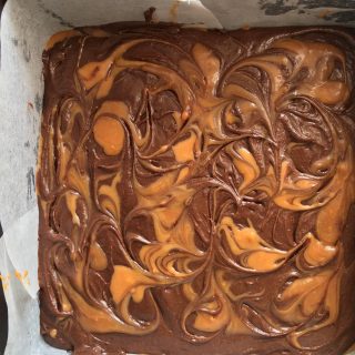 A tin of unbaked salted caramel brownies ready to be baked.