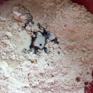 A bowl of flour, milk and treacle for making scones