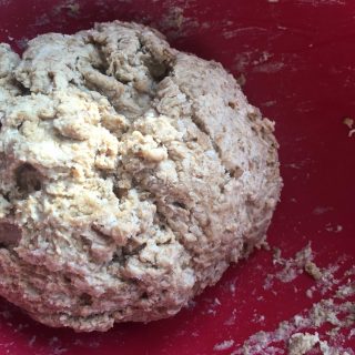 dough in a red bowl for making treacle scones