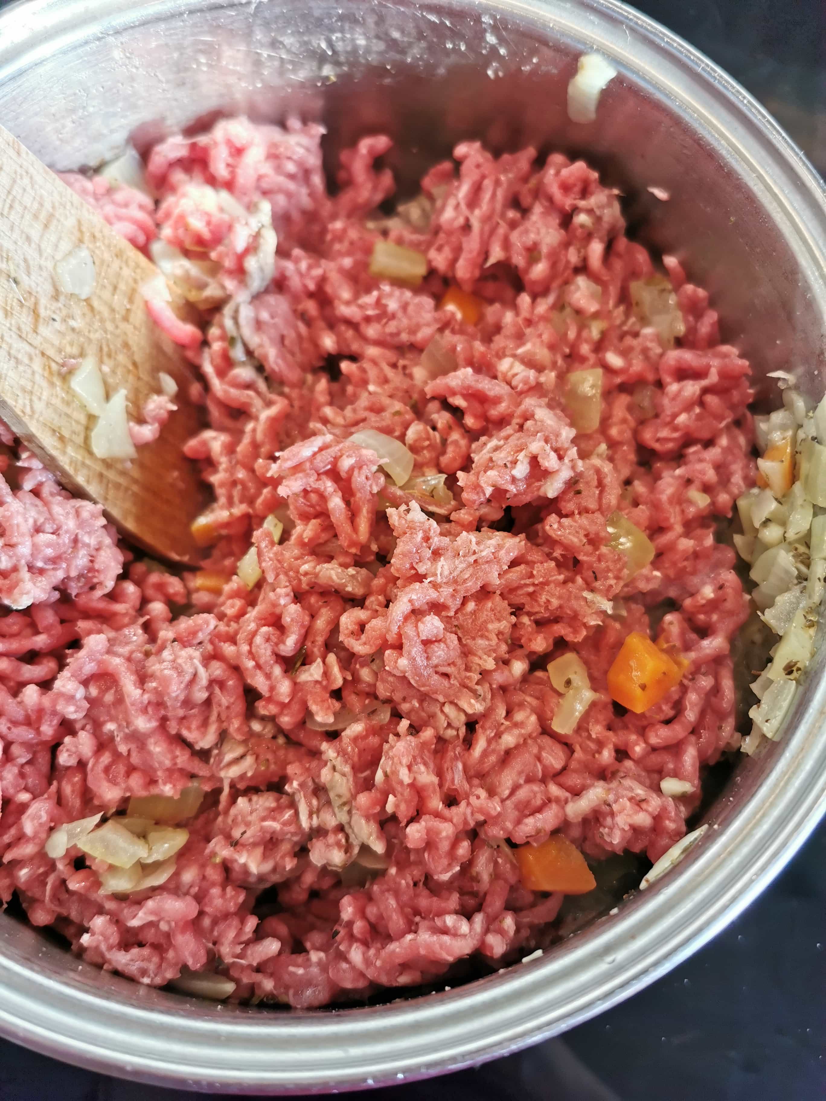 A pan of mince, onions, celery and carrots browning