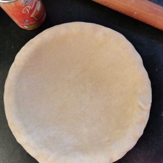an unbaked pie shell for making pumpkin pie
