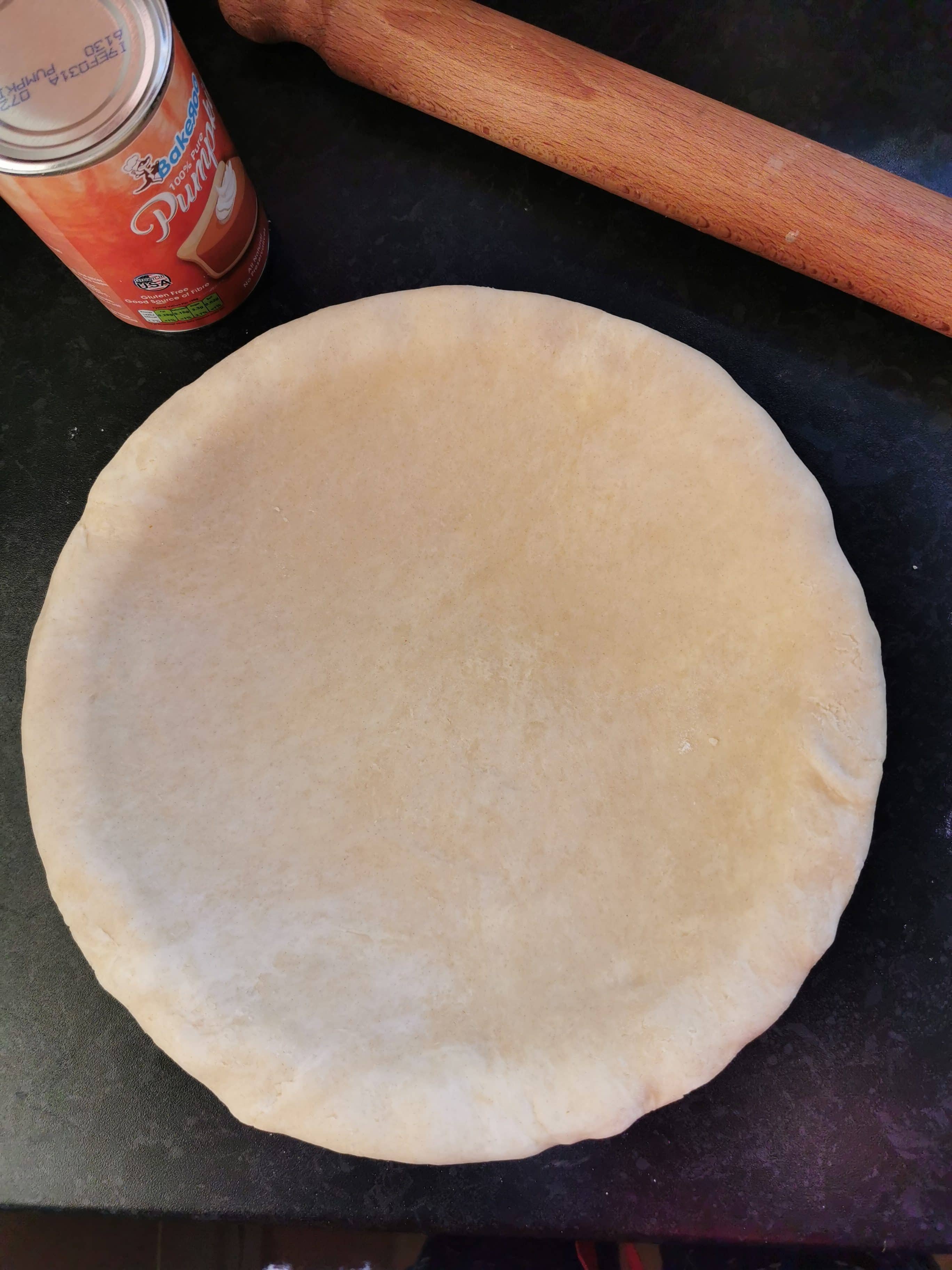 an unbaked pie shell for making pumpkin pie