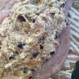 a butterflied turkey breast with apricot and cranberry stuffing