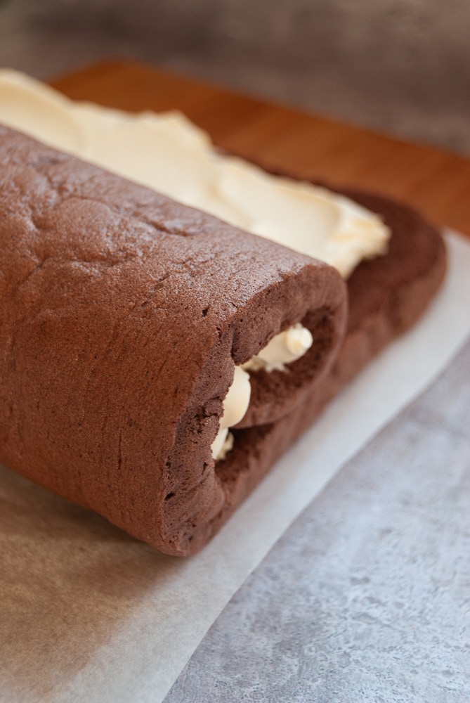 A rolled up chocolate sponge filled with whipped cream