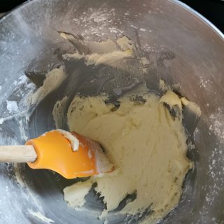 A silver bowl of creamed butter and sugar