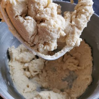 A silver Kitchen aid bowl of cookie dough