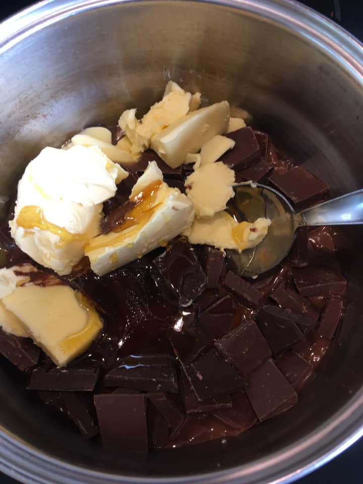 A pan of butter, syrup and chocolate for making rocky road