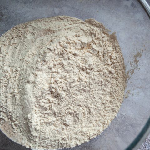a bowl of flour, sugar, salt and yeast