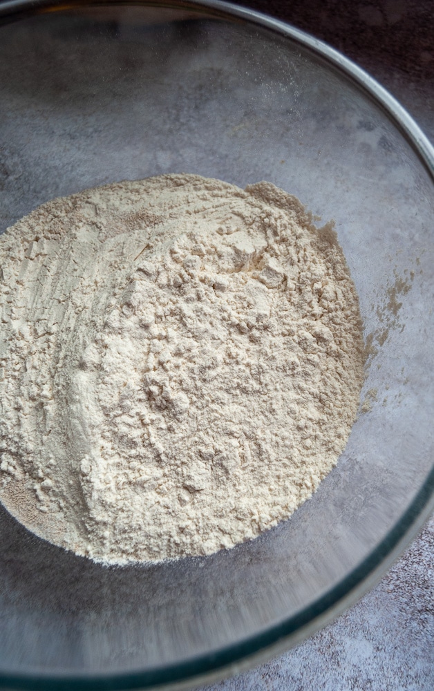 a bowl of flour, sugar, salt and yeast