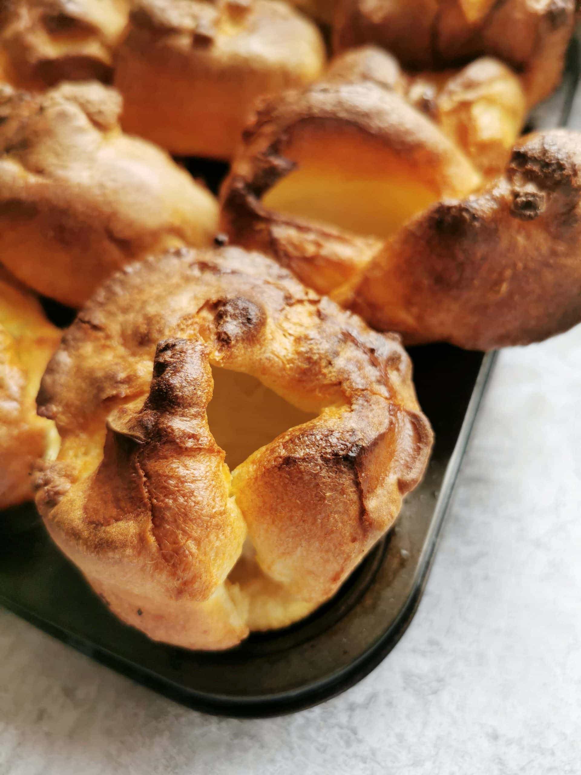 A close up picture of a yorkshire pudding in a muffin tin