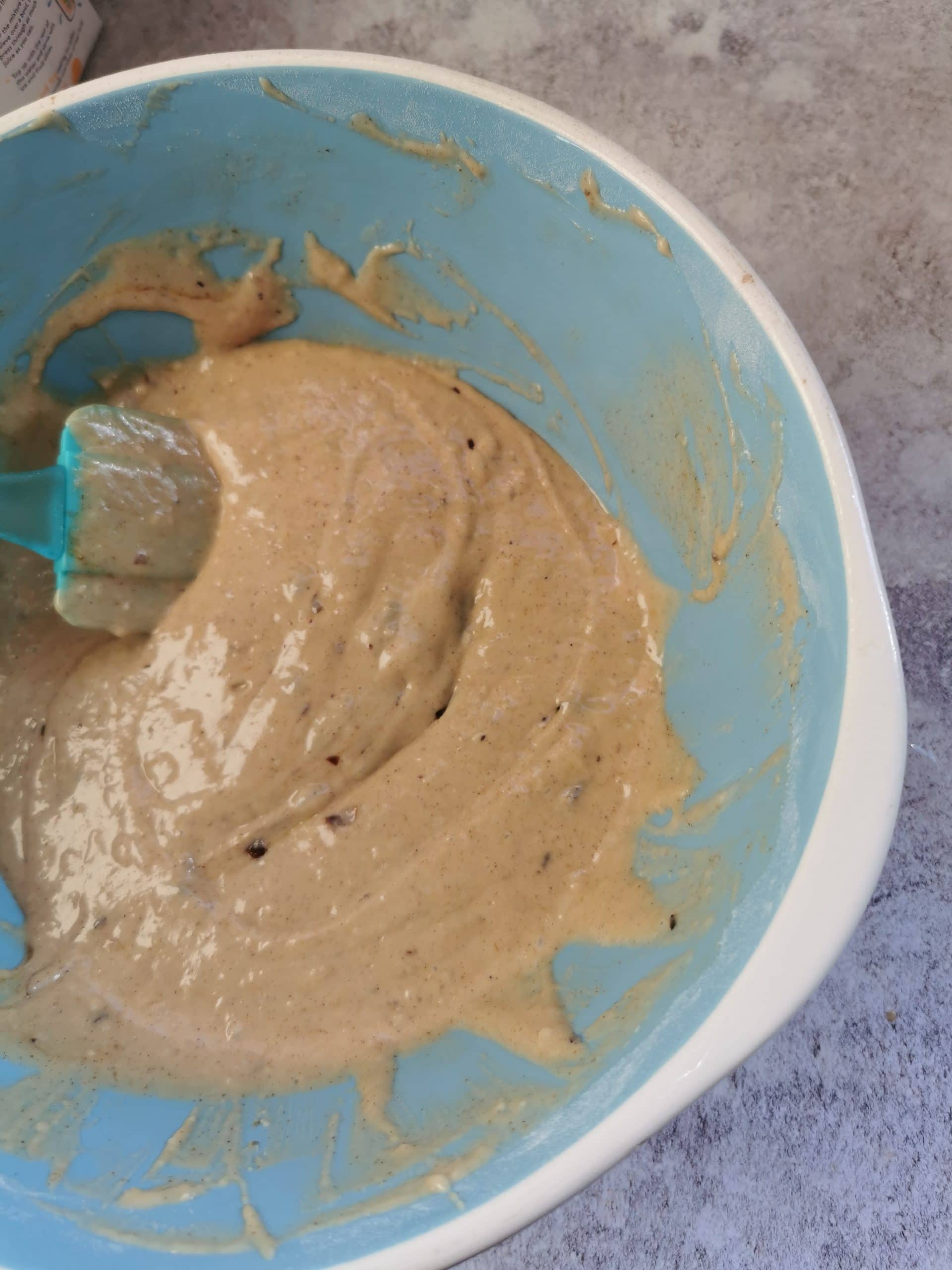 Pancake batter in a blue and white bowl
