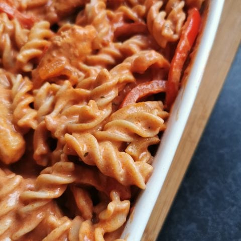 Pasta coated in a creamy spicy tomato sauce with onions and bell peppers