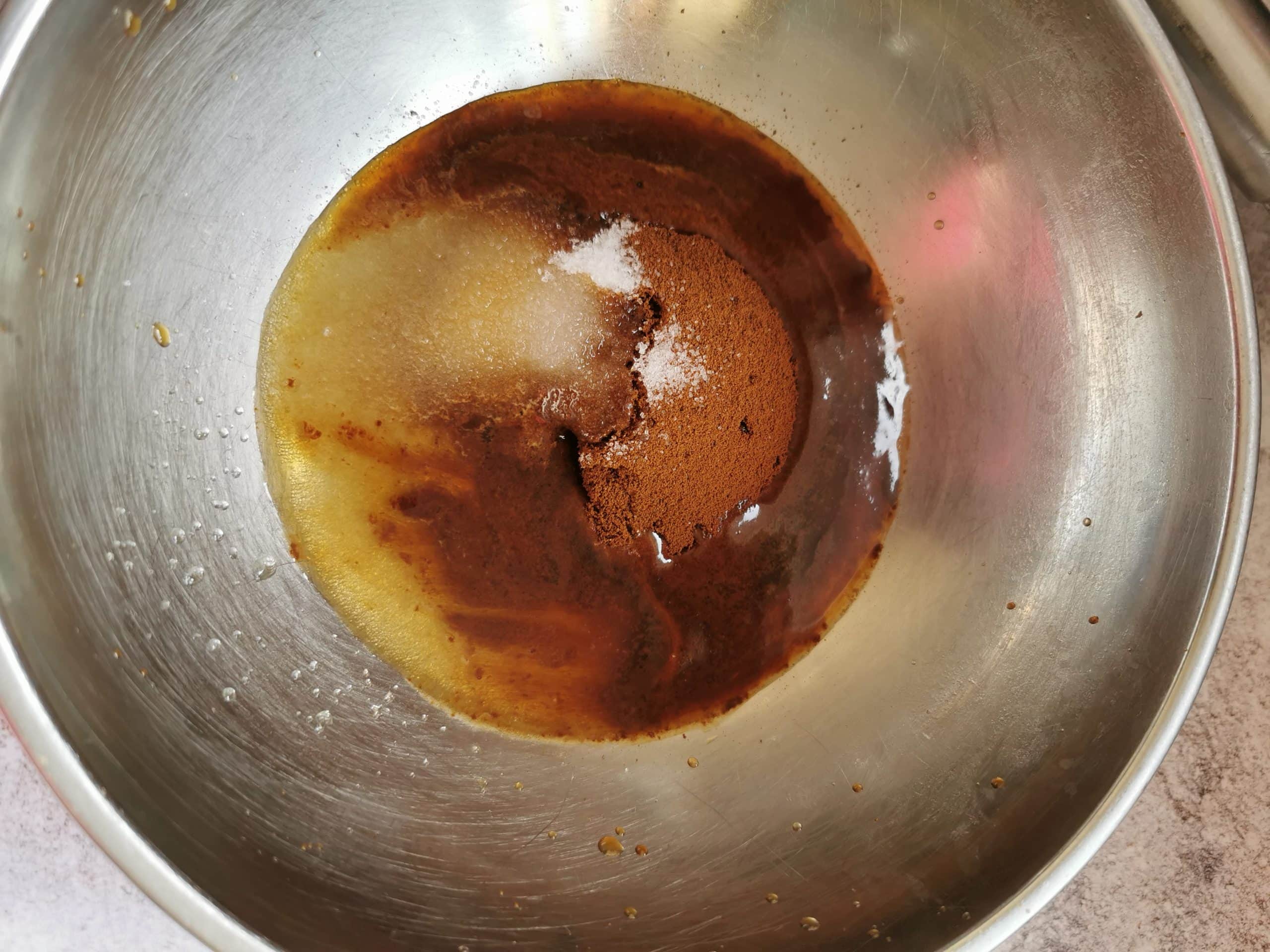 Instant coffee, sugar and hot water in a silver bowl
