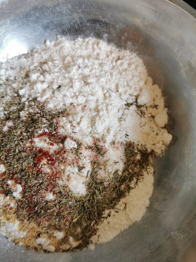 A bowl of flour and spices for making southern fried chicken 