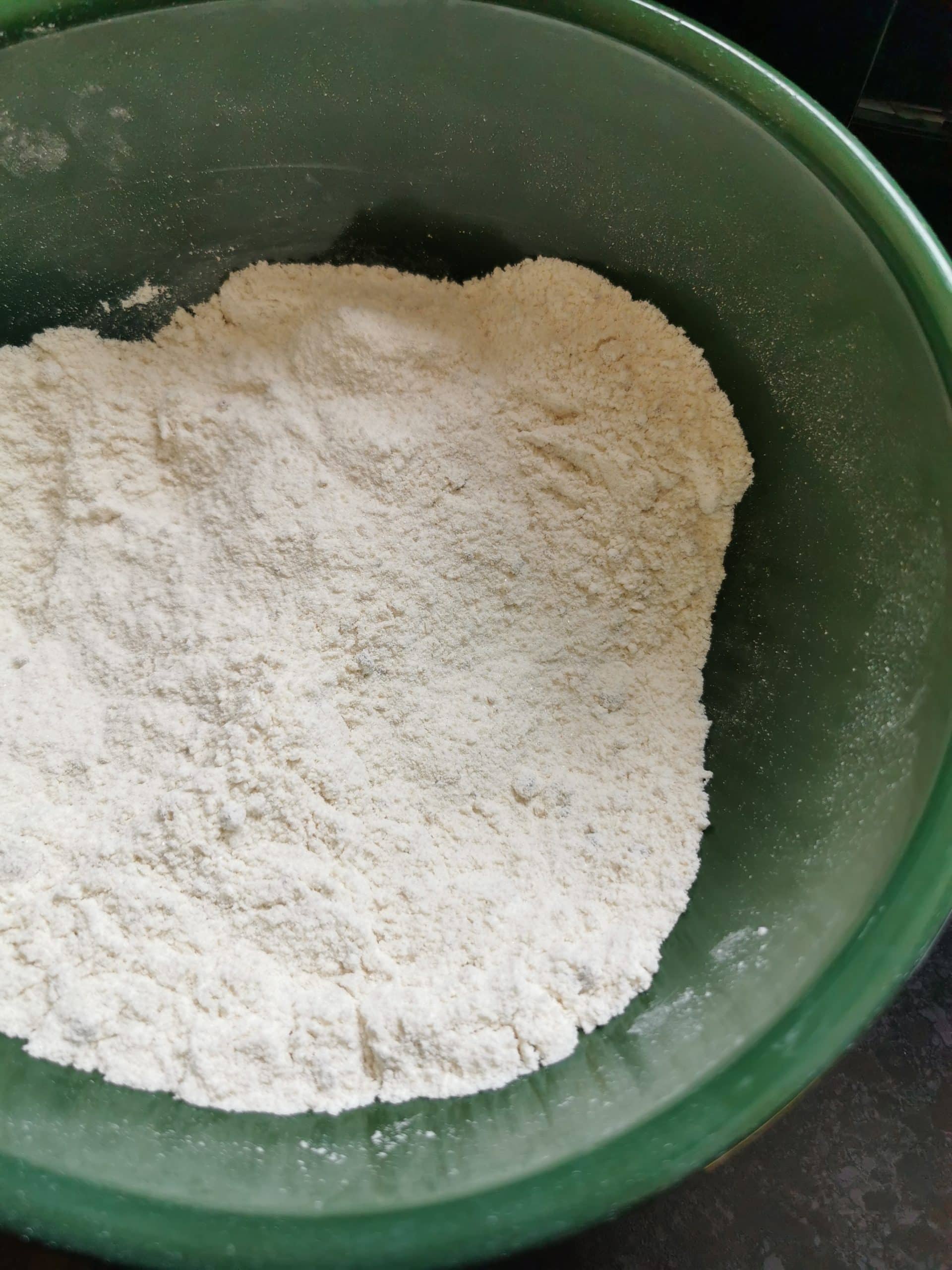 A green bowl of flour.