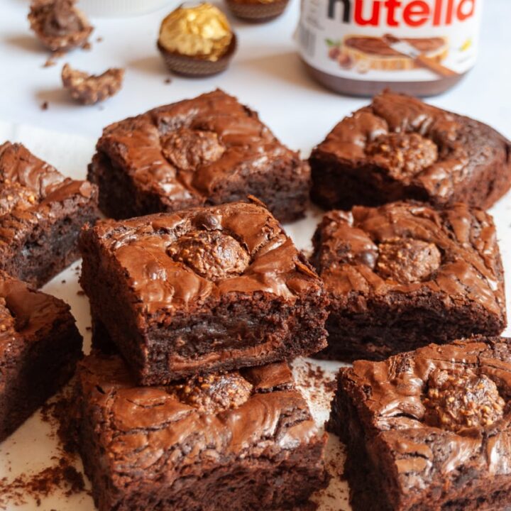 a batch of Nutella brownies on a wooden board.