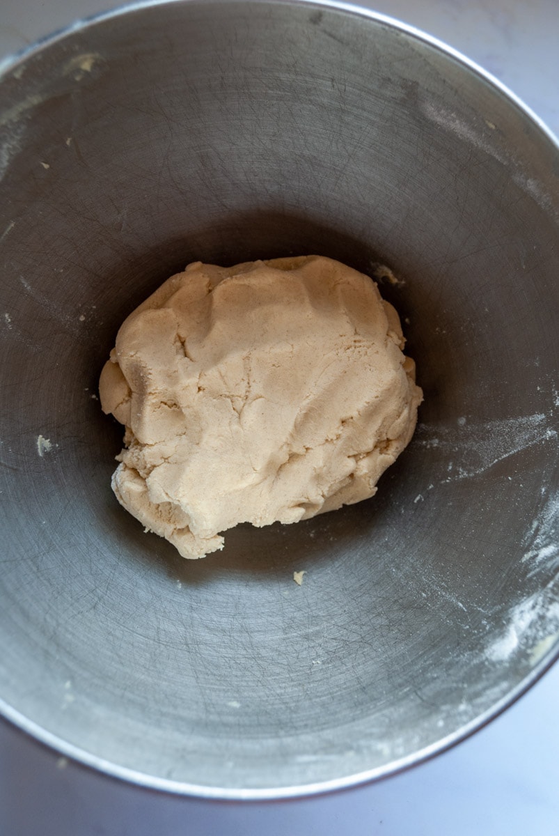 a silver bowl of biscuit dough.