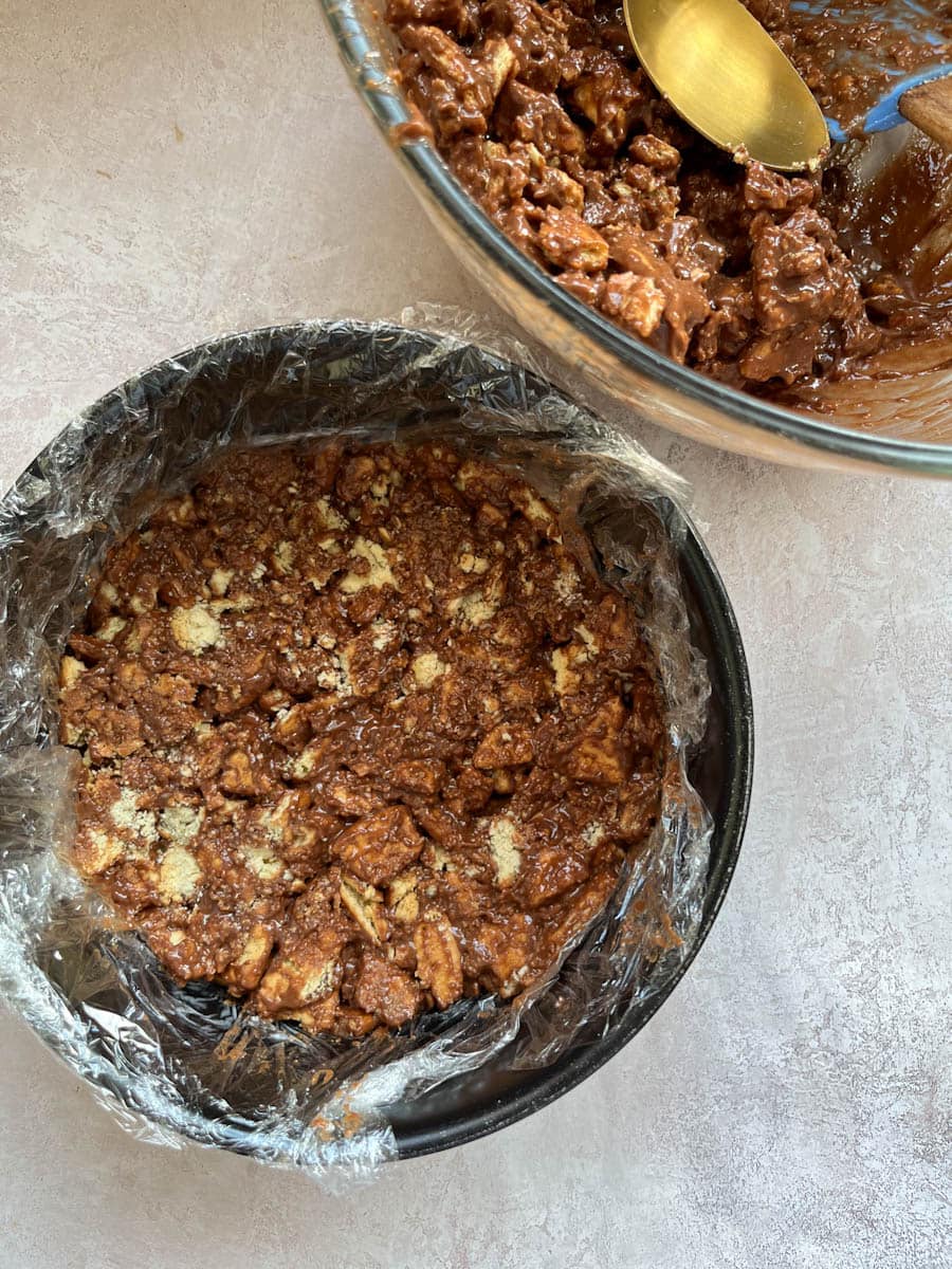 a chocolate biscuit cake in a round cake tin.