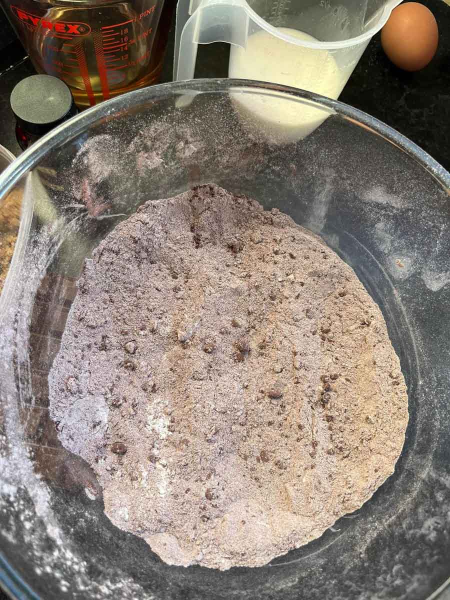 a large mixing bowl of flour and cocoa powder.