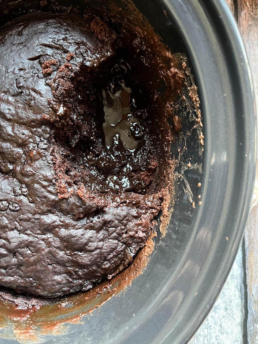 a slow cooker bowl of chocolate fudge pudding.