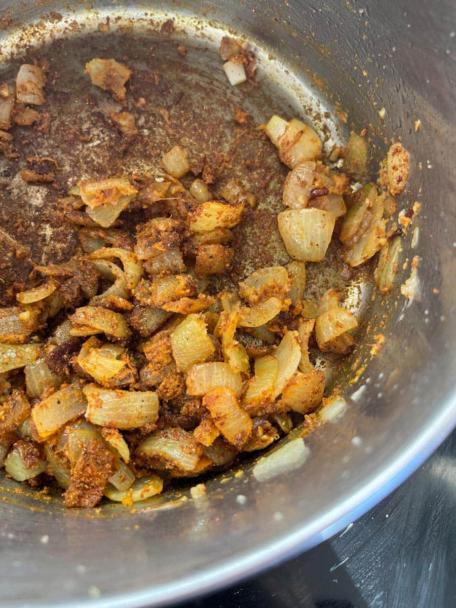 a pan of diced onions and spices