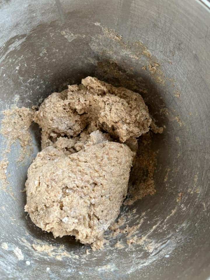 a silver bowl of bread dough.