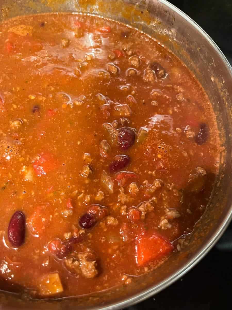 A silver pan of chilli con carne with kidney beans.