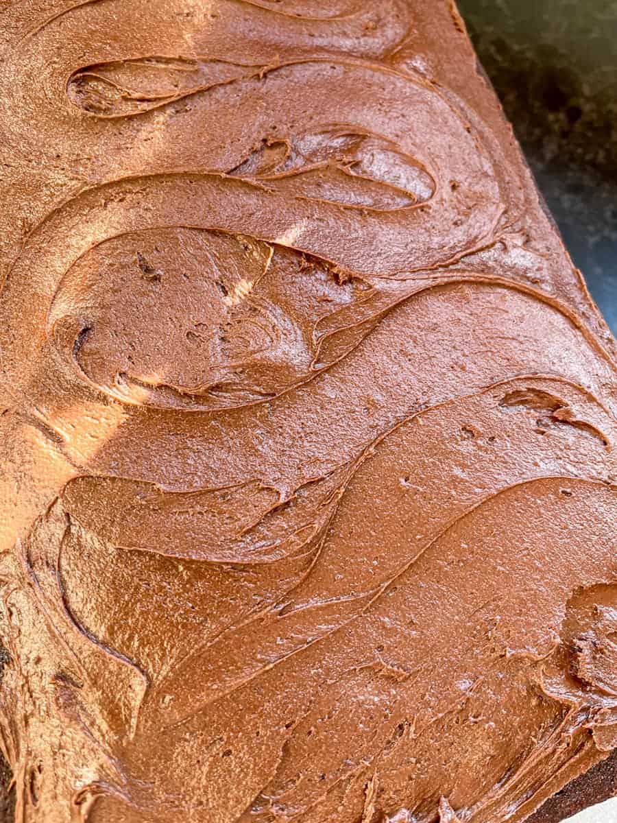 A chocolate sheet cake covered in chocolate fudge frosting.