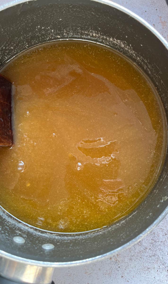 A saucepan of melted butter, sugar and golden syrup.