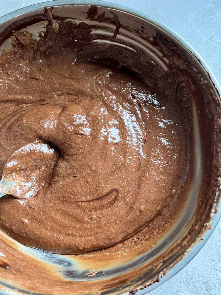 A silver bowl of chocolate mousse.
