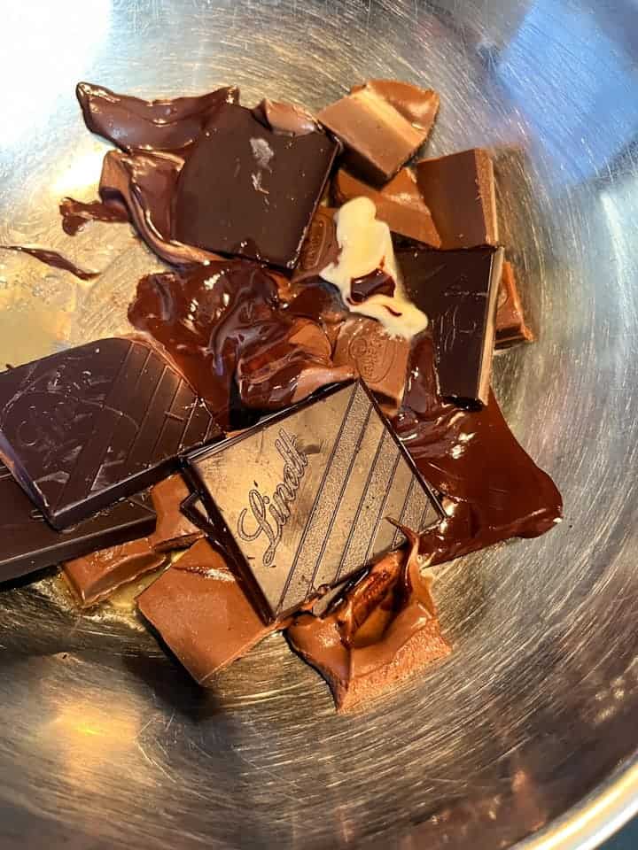 chocolate and butter melting in a silver pan.