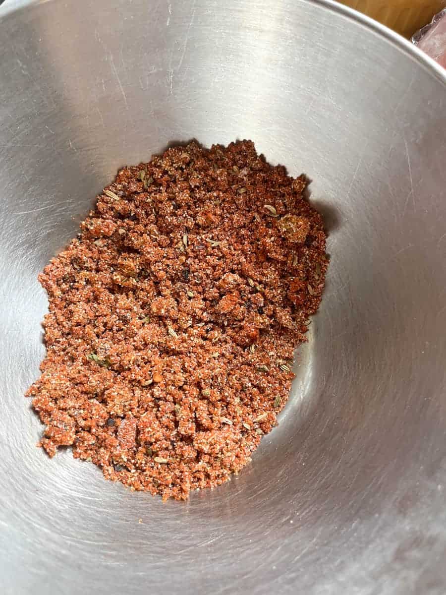A silver bowl of spice mix.