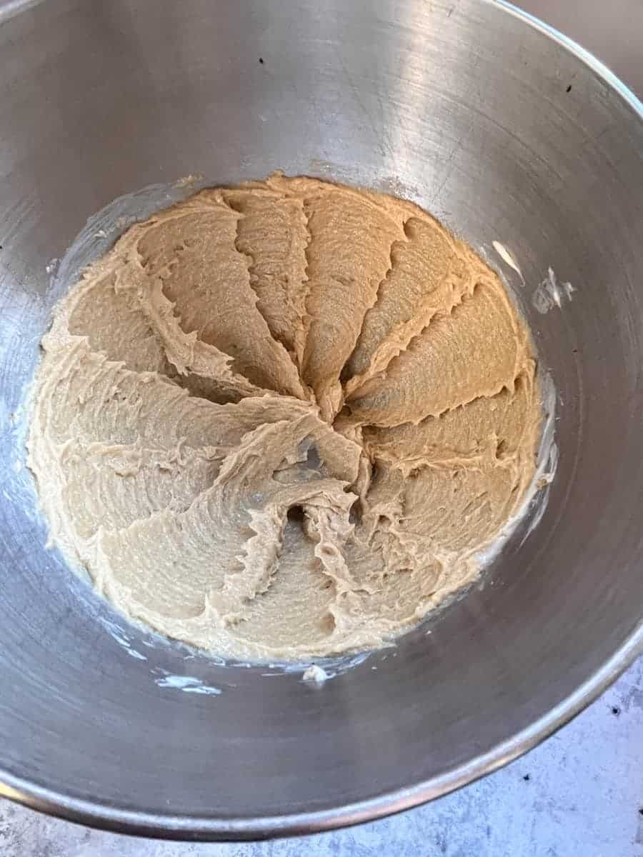 Creamed brown sugar and butter in a sliver bowl.