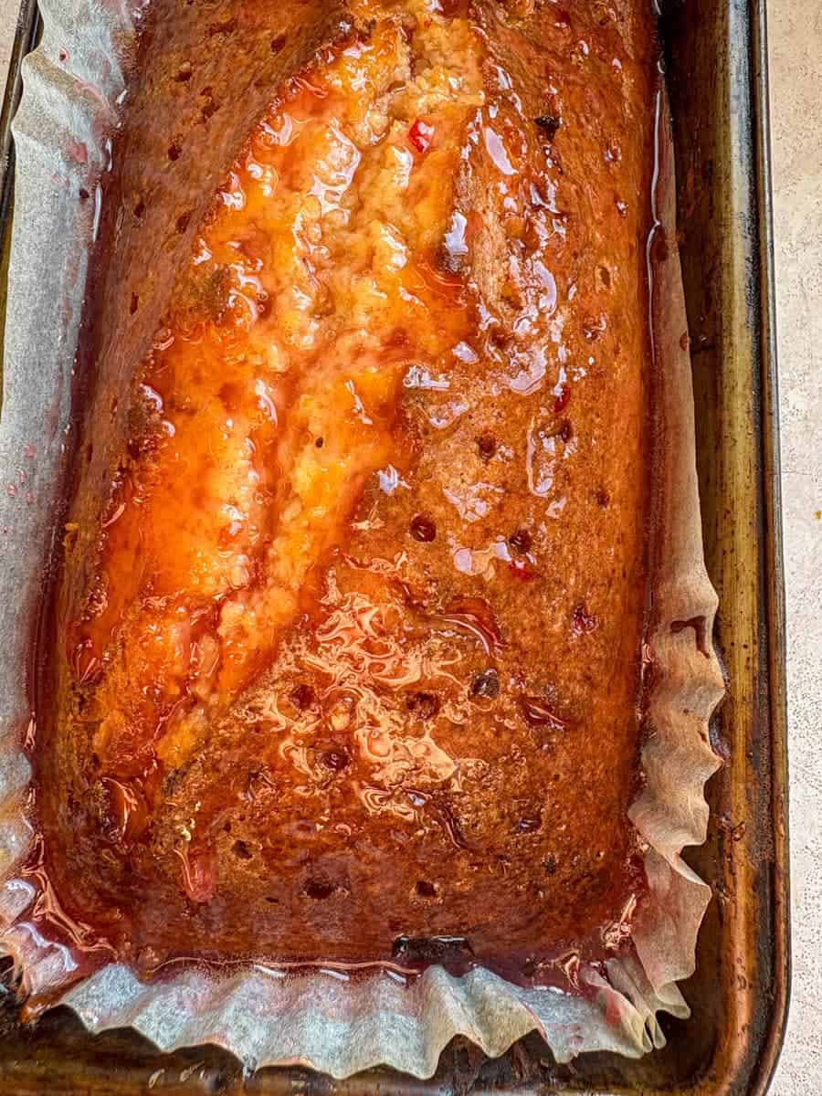 Blood orange syrup poured over a loaf cake.